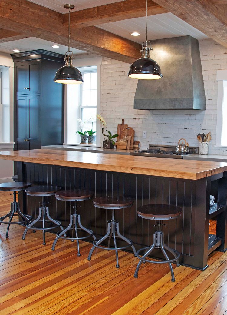 rustic kitchen remodel in Ephrata, PA, with butcher's block island, hardwood floors, and white brick backsplash