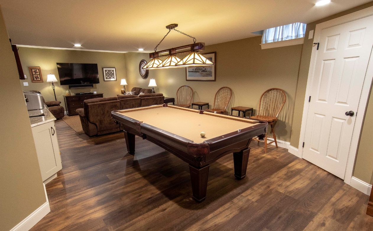 finished basement with pool table in a PA basement with vinyl wood look floors
